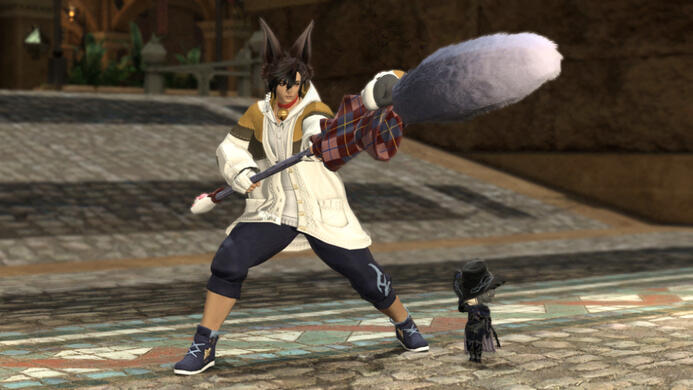 Cinnamon, a Viera with dark hair and light skin, wielding a cat toy as a dragoon in Ul'dah. Their wind-up Zero tips their hat.